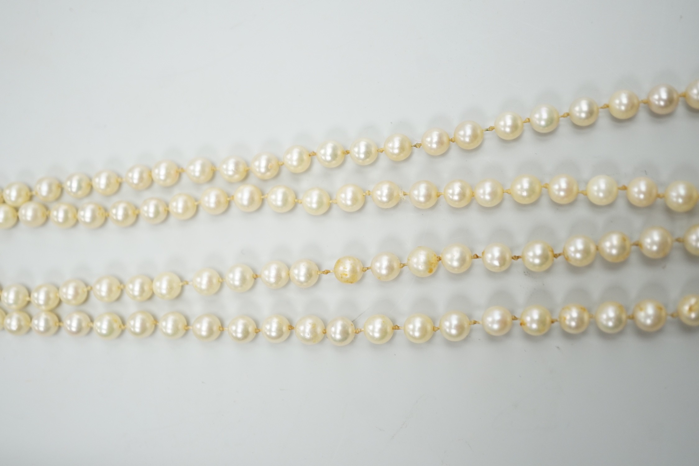 A single strand cultured pearl necklace, with 9ct white gold and diamond chip set clasp, 80cm.